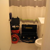 Bathroom filled with equipment cases