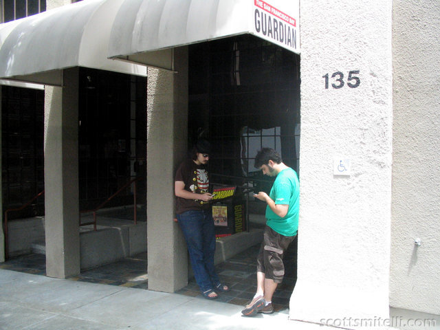 Checking Reddit outside of the Digg building.