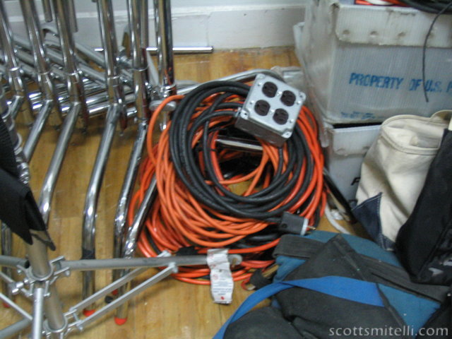 The pile of seven extension cords and other power manipulation devices we used to run the 7,000 watts of lighting in the room.
