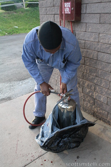 Filling a fire extinguisher with air and blood.