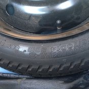 This spare tire is over twenty-one years old.